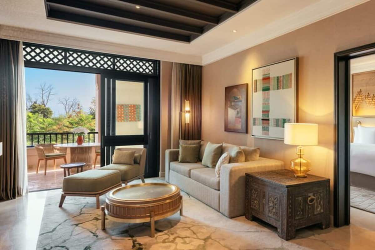Pool View Terrace Suite | Living room | 40-inch LED TV with satellite channels, TV, DVD player
