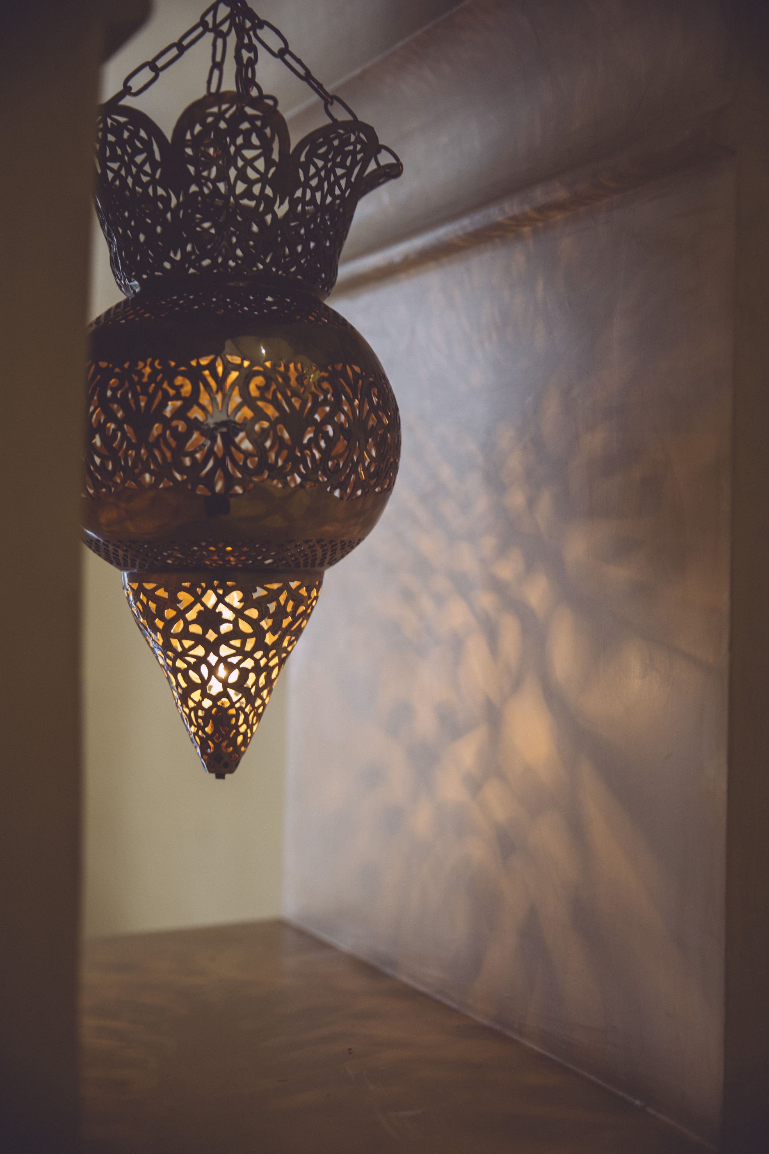 A hanging lantern with intricate metalwork.