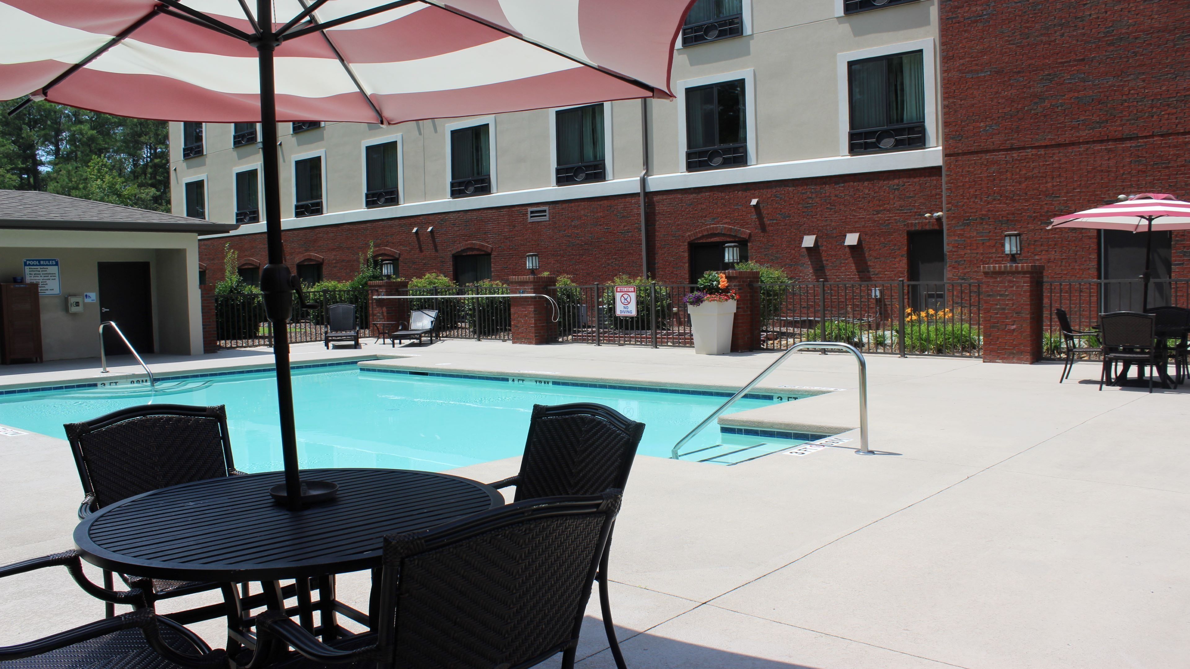 Seasonal outdoor pool, open 10:00 AM to 10 PM, pool umbrellas