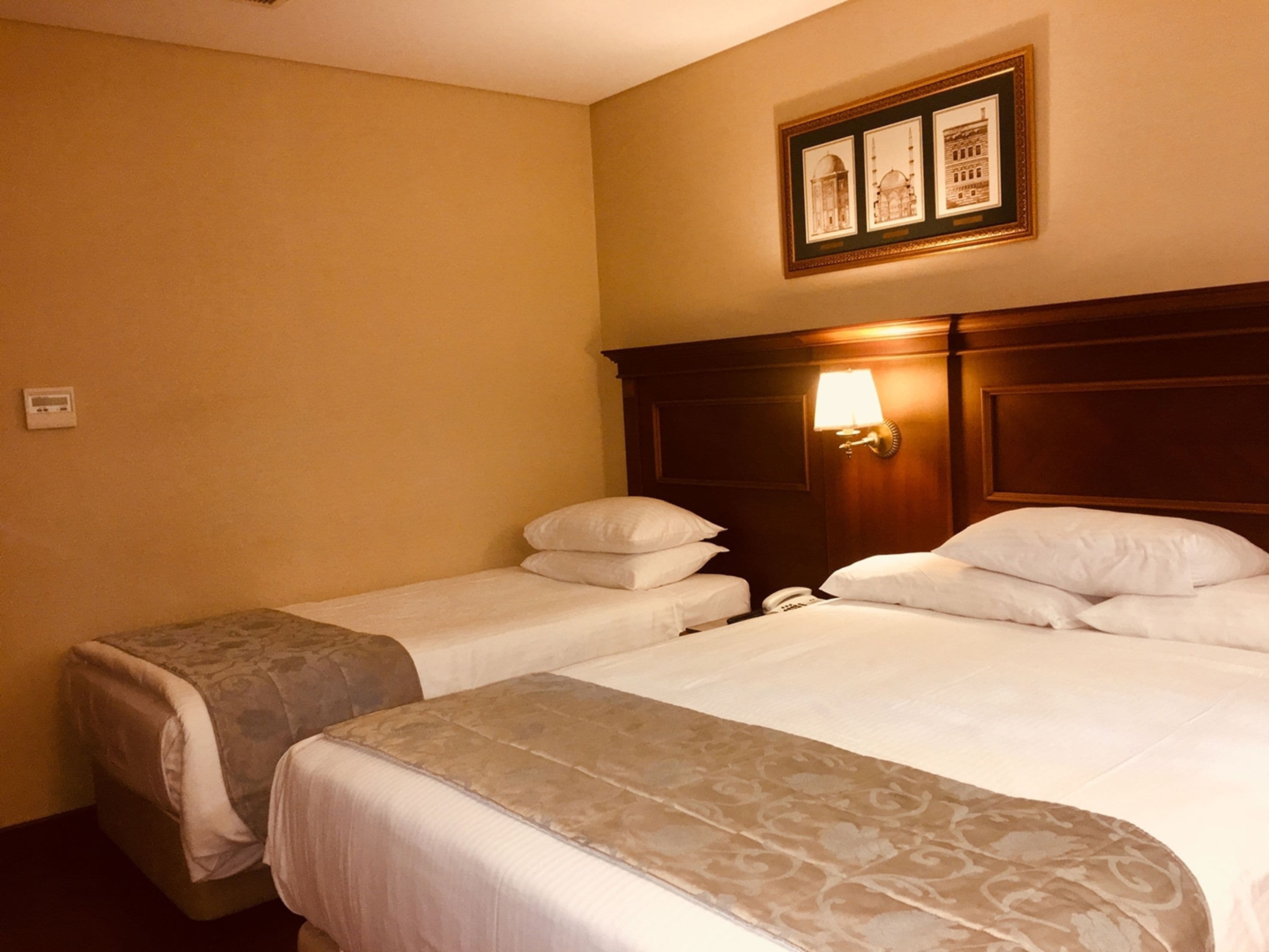 economy triple room | 1 bedroom, premium bedding, minibar, in-room safe