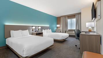 Ropa de cama de alta calidad y caja de seguridad en la habitación