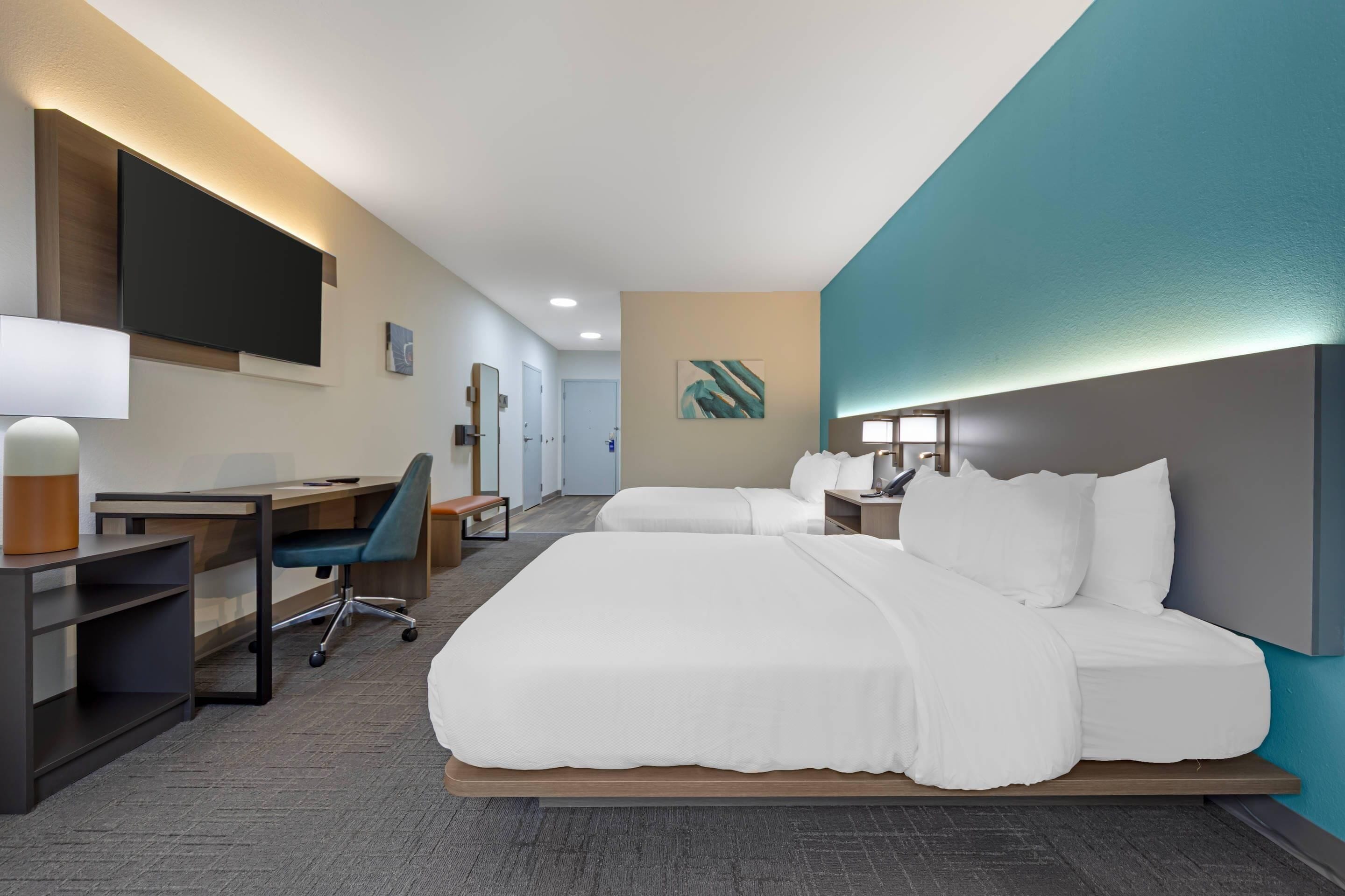 Sviitti, useita sänkyjä, esteetön, tupakointi kielletty | Ylelliset vuodevaatteet, tallelokero huoneessa, työpöytä