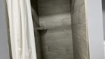 Shower, rainfall showerhead, hair dryer, towels