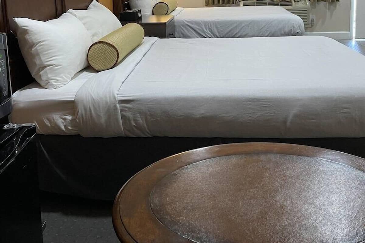 Hypo-allergenic bedding, down duvets, laptop workspace