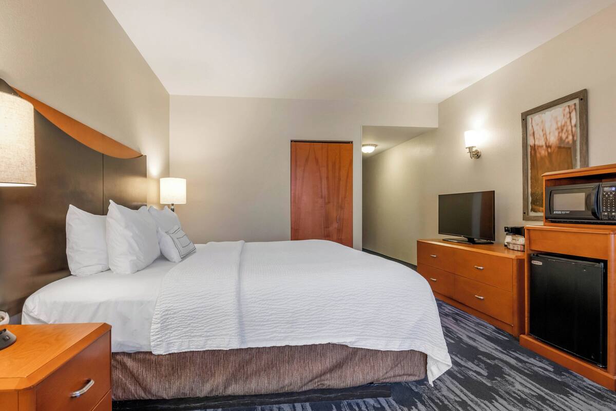 premium bedding, desk, blackout curtains, iron/ironing board