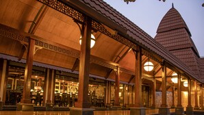 A traditional building with a tiled roof and a large central tower. - Ananta Spa and Resorts (Pushkar)