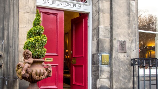 A building entrance with a red door labeled "SIX BRUNTON PLACE". - Six Brunton Place (Edinburgh)
