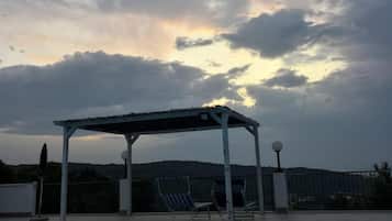 Seasonal outdoor pool, pool umbrellas, pool loungers