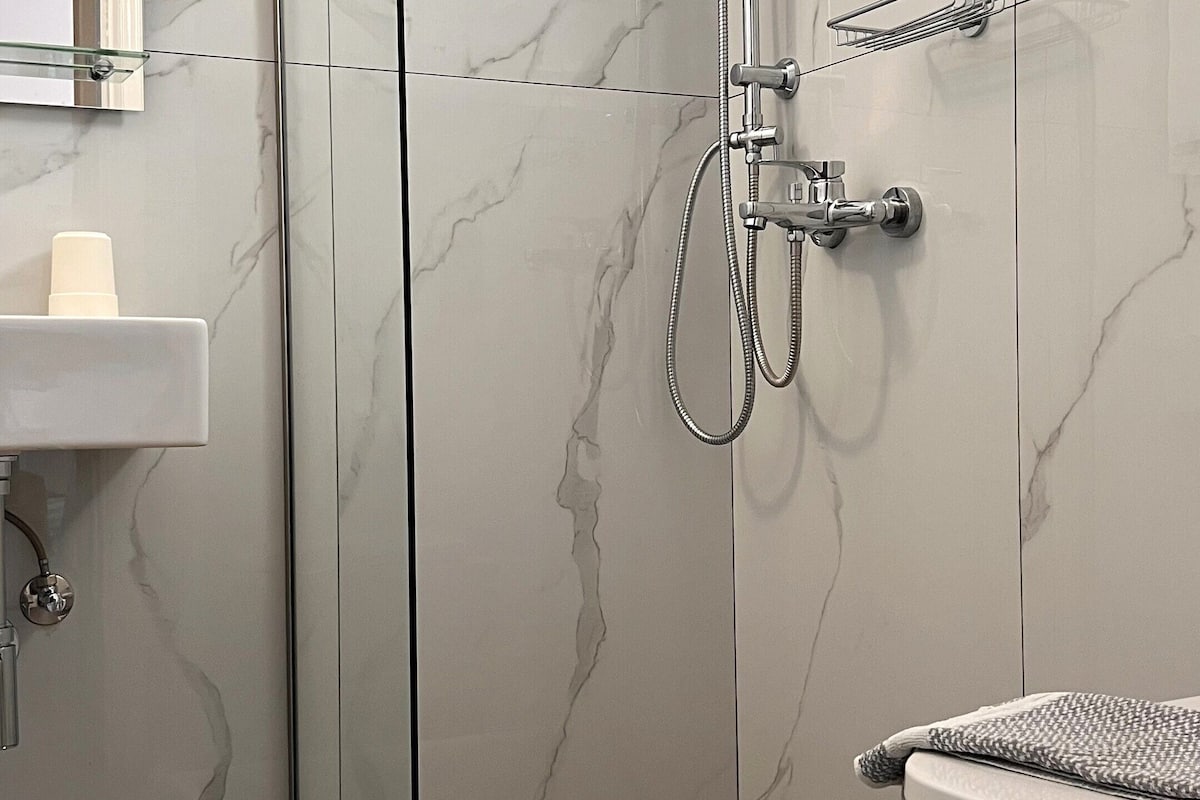 standard room | bathroom | shower, hair dryer, towels, soap