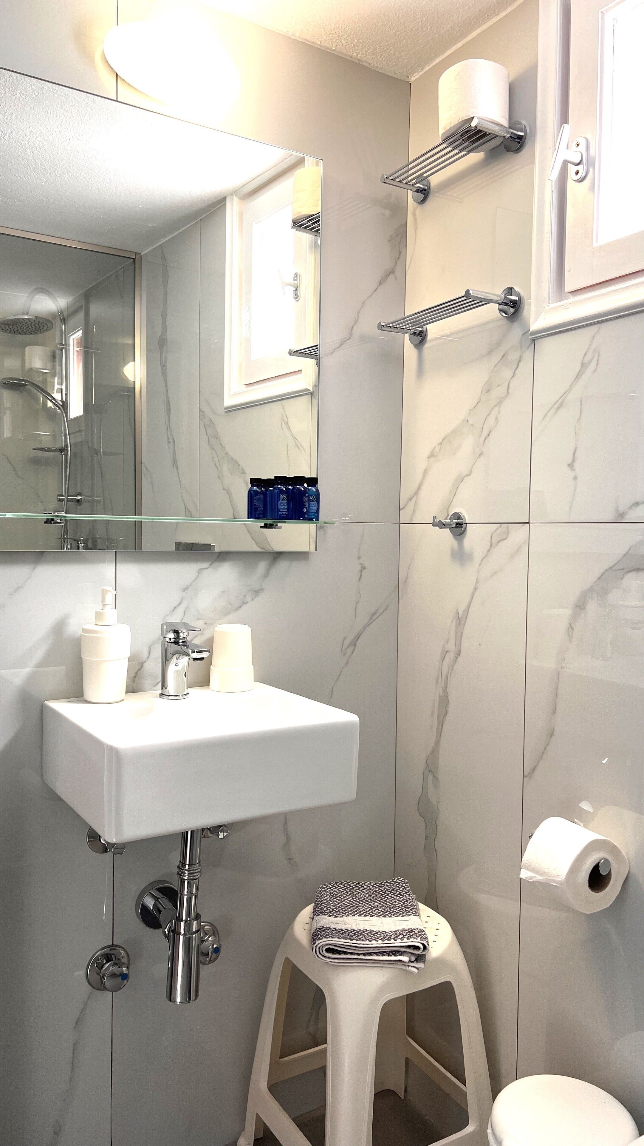 standard room | bathroom | shower, hair dryer, towels, soap