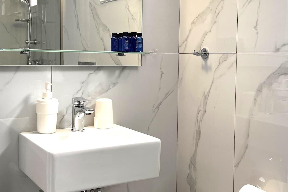 standard room | bathroom | shower, hair dryer, towels, soap