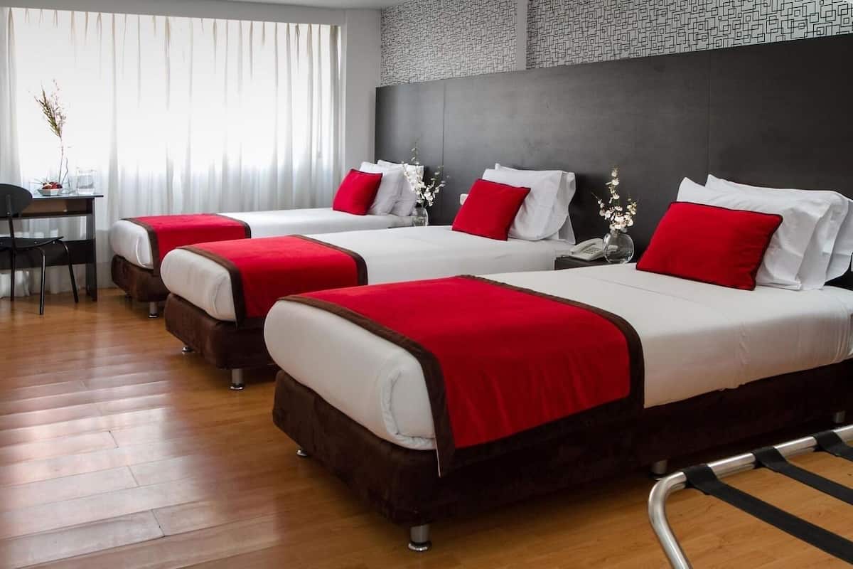 Basic Triple Room | Pillowtop beds, in-room safe, desk, iron/ironing board