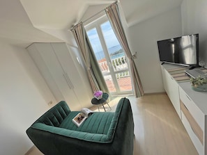 Deluxe Apartment, 2 Bedrooms, Terrace, Sea View | Living area | 32-inch TV with satellite channels