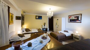 Family Triple Room, 1 Bedroom | Pillow-top beds, minibar, in-room safe, desk
