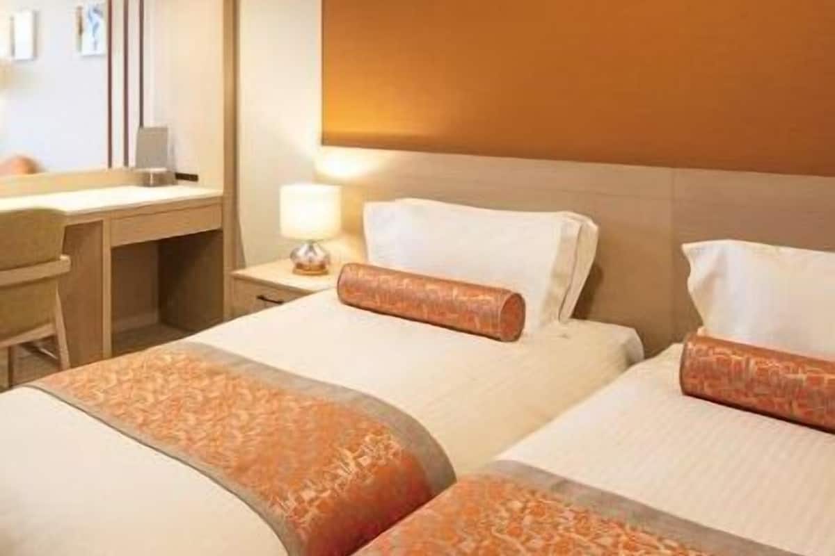 Premium bedding, down duvets, in-room safe, desk