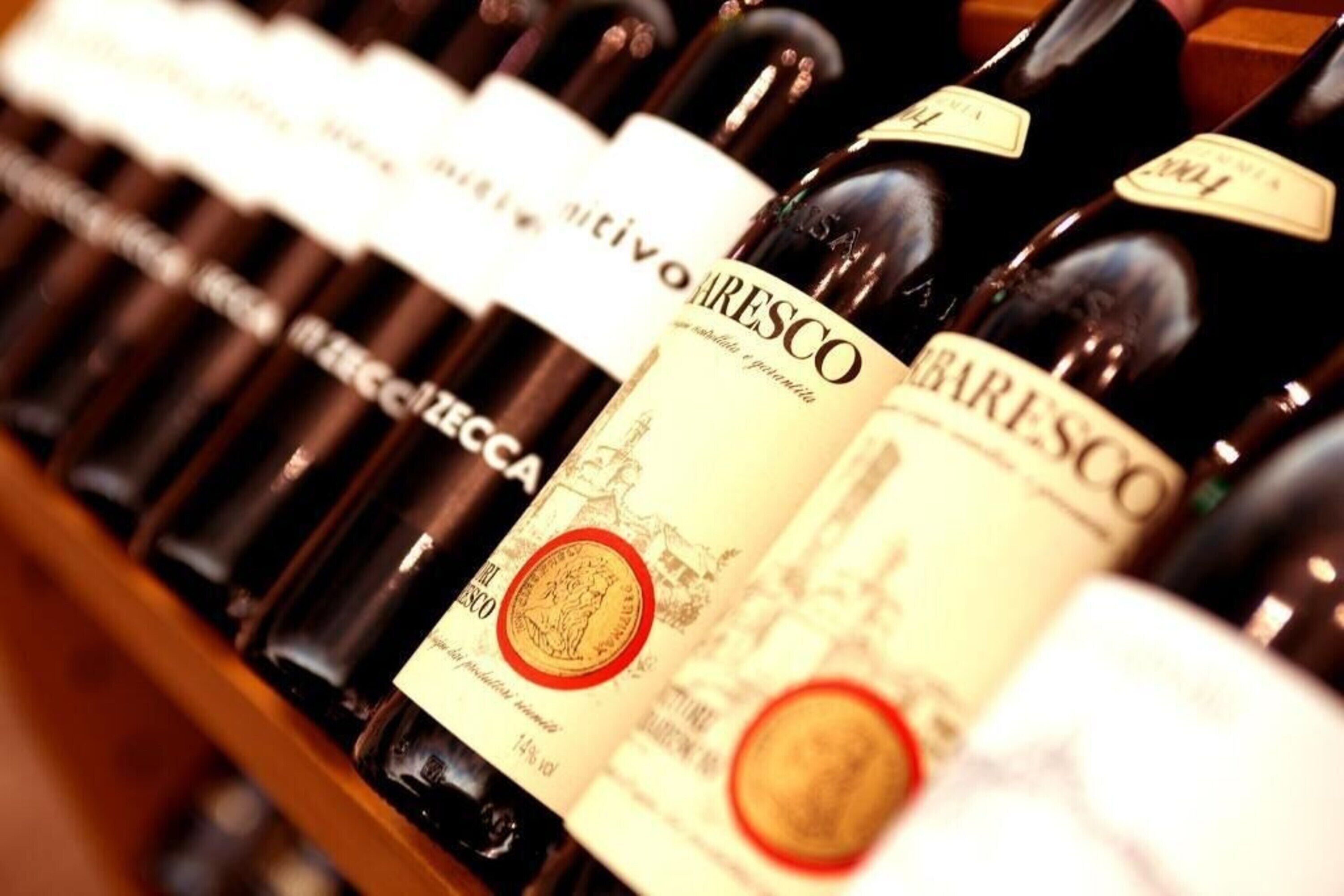 A row of wine bottles with labels, including 'MARESCO' and 'VINEYARDS'.