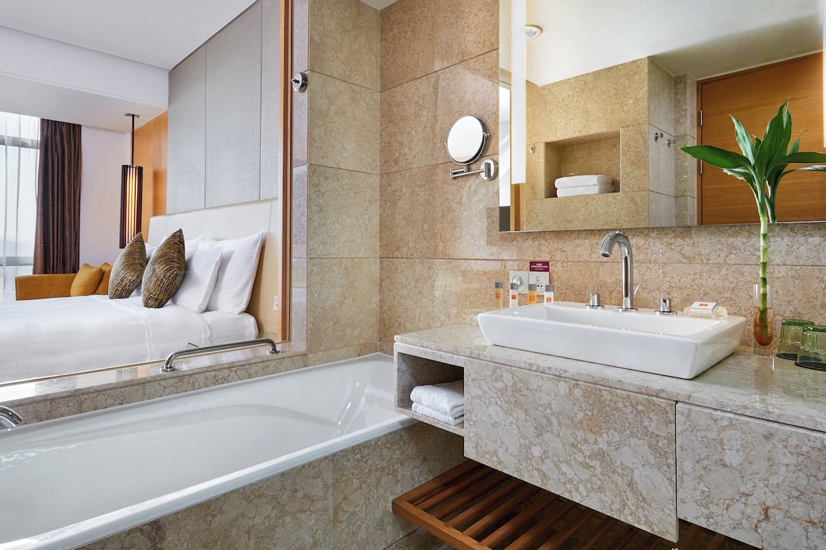 hair dryer, bathrobes, slippers, towels