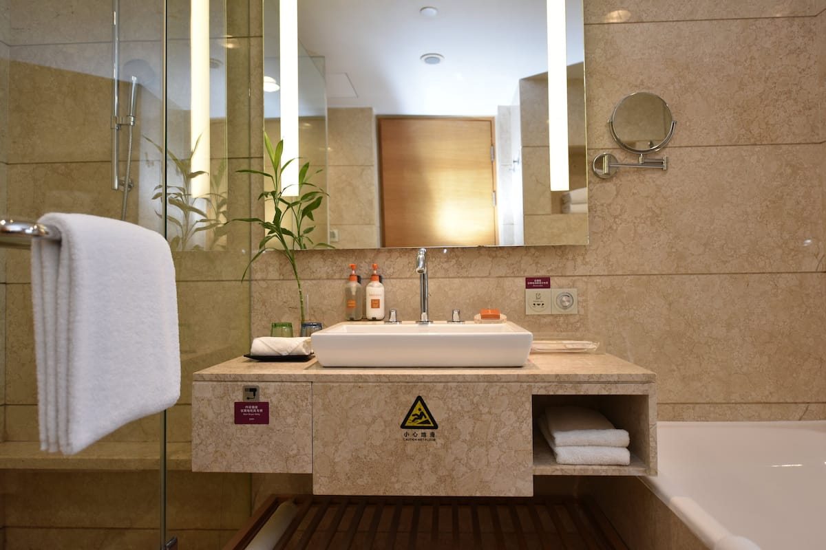 hair dryer, bathrobes, slippers, towels