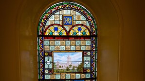 A stained glass window with intricate designs and a central figure. - Strathallan Guest House (Edinburgh)