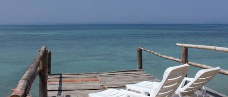 Private beach, white sand, beach towels, beach massages