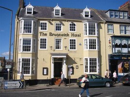 The Brunswick Hotel with a traditional facade, multiple windows, and a prominent entrance.