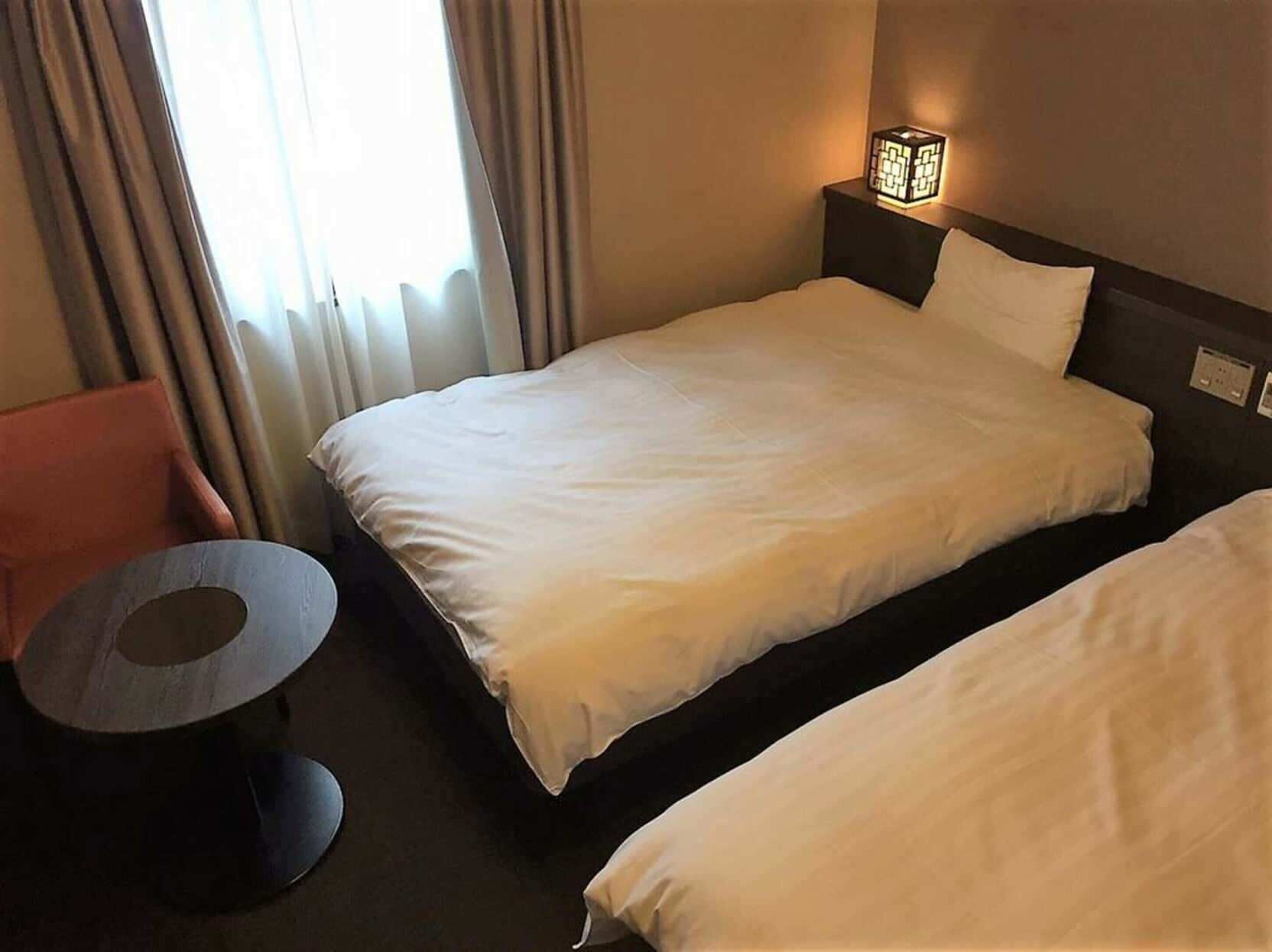 Premium bedding, down duvets, blackout curtains, iron/ironing board