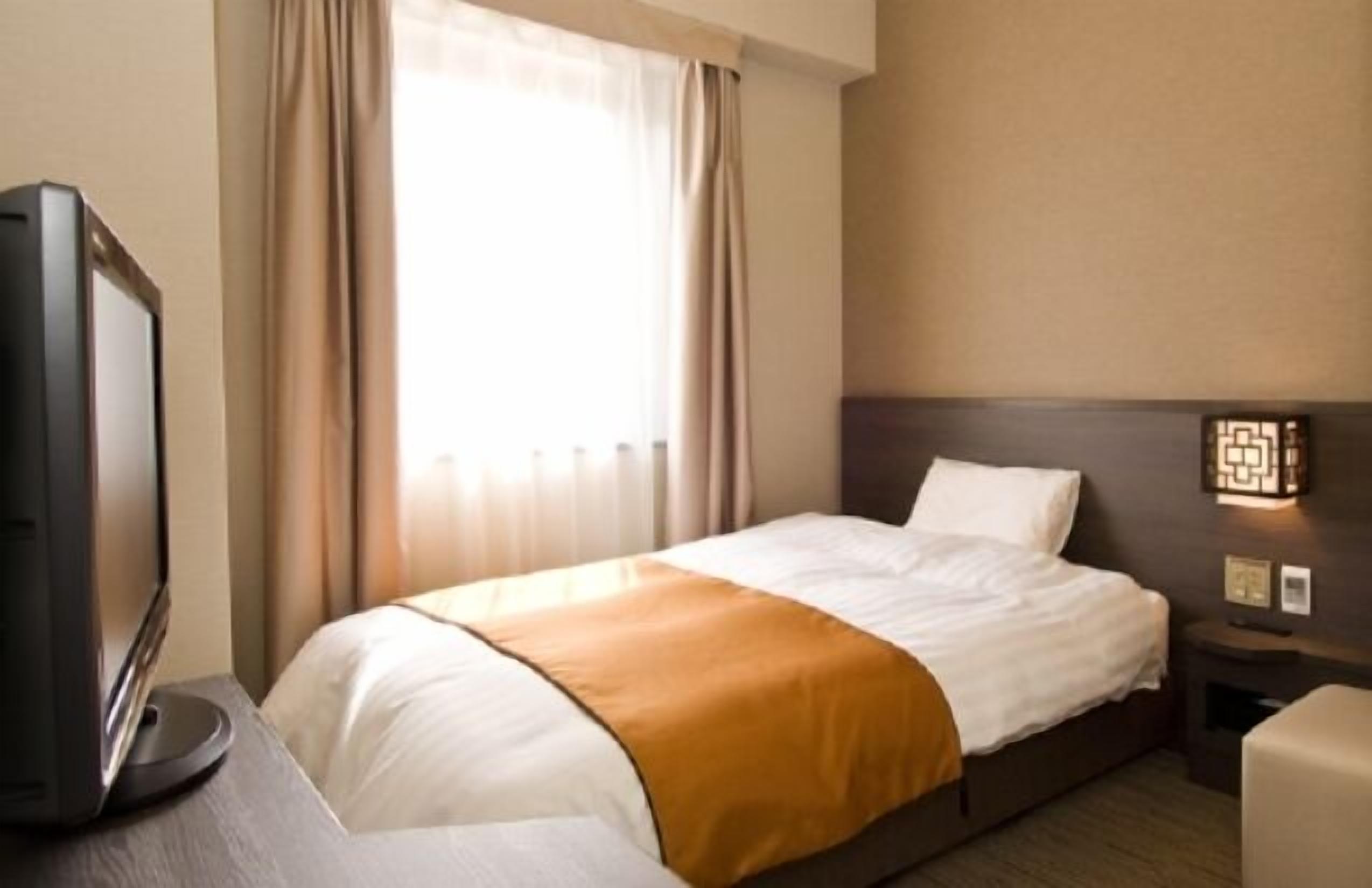 Premium bedding, down comforters, blackout drapes, iron/ironing board