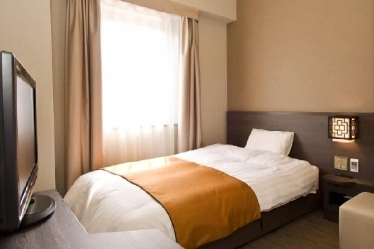 Premium bedding, down comforters, blackout drapes, iron/ironing board