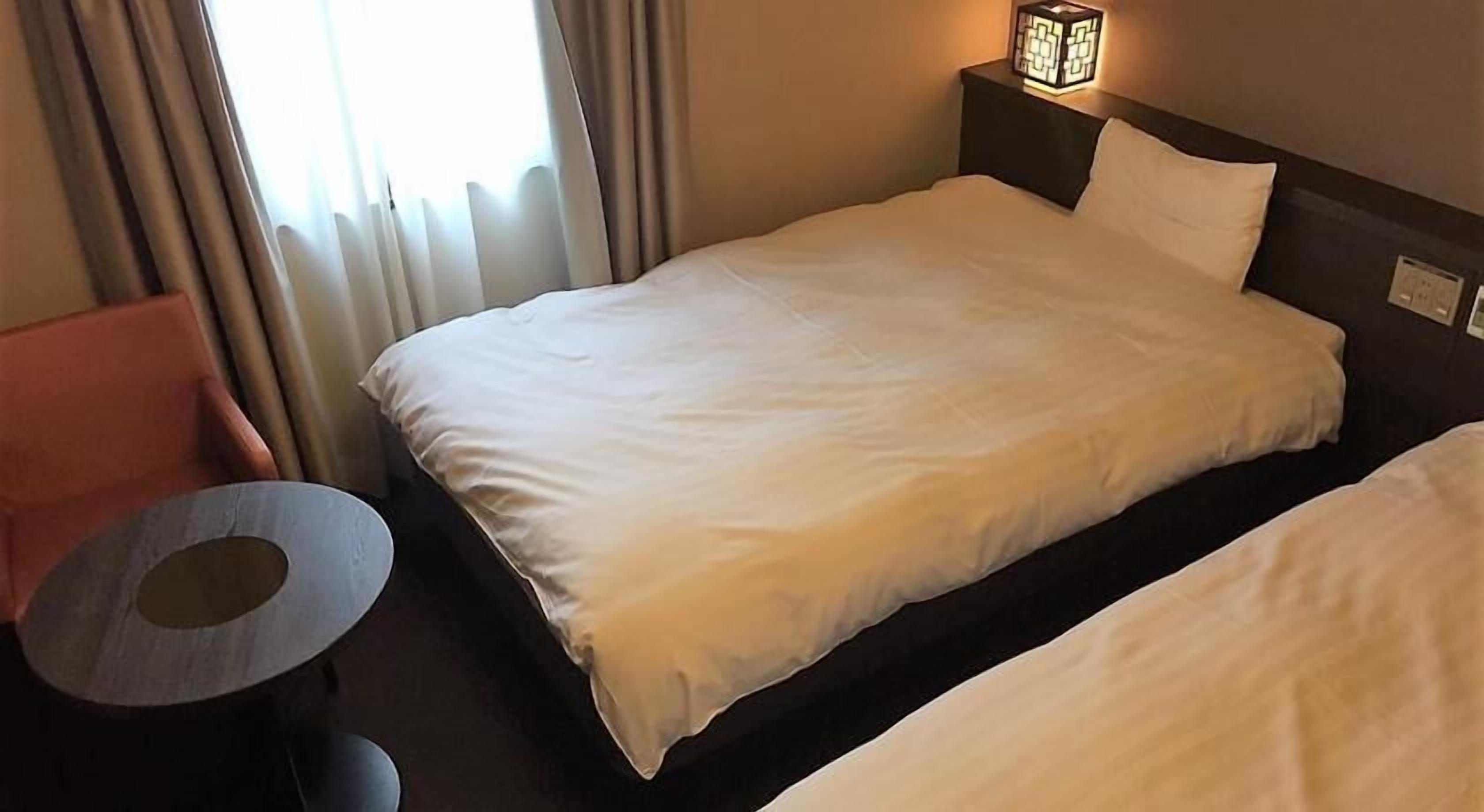 Premium bedding, down duvets, blackout curtains, iron/ironing board