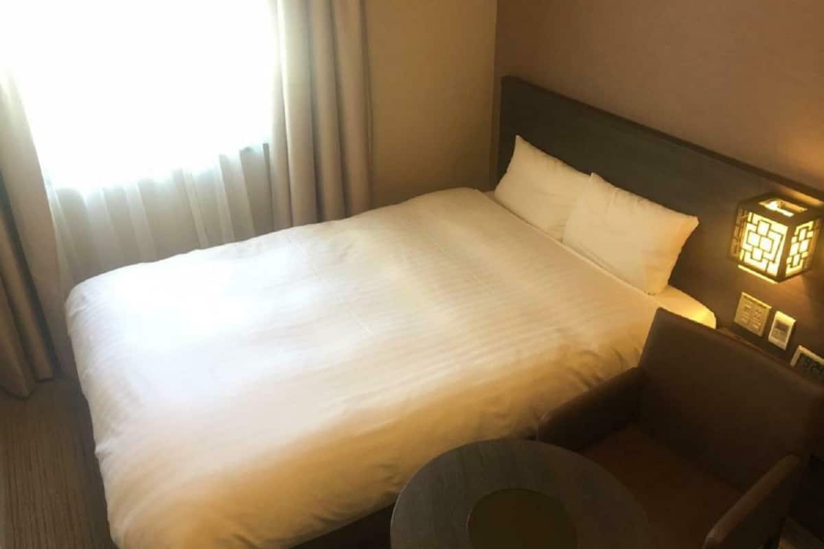 Premium bedding, down comforters, blackout drapes, iron/ironing board