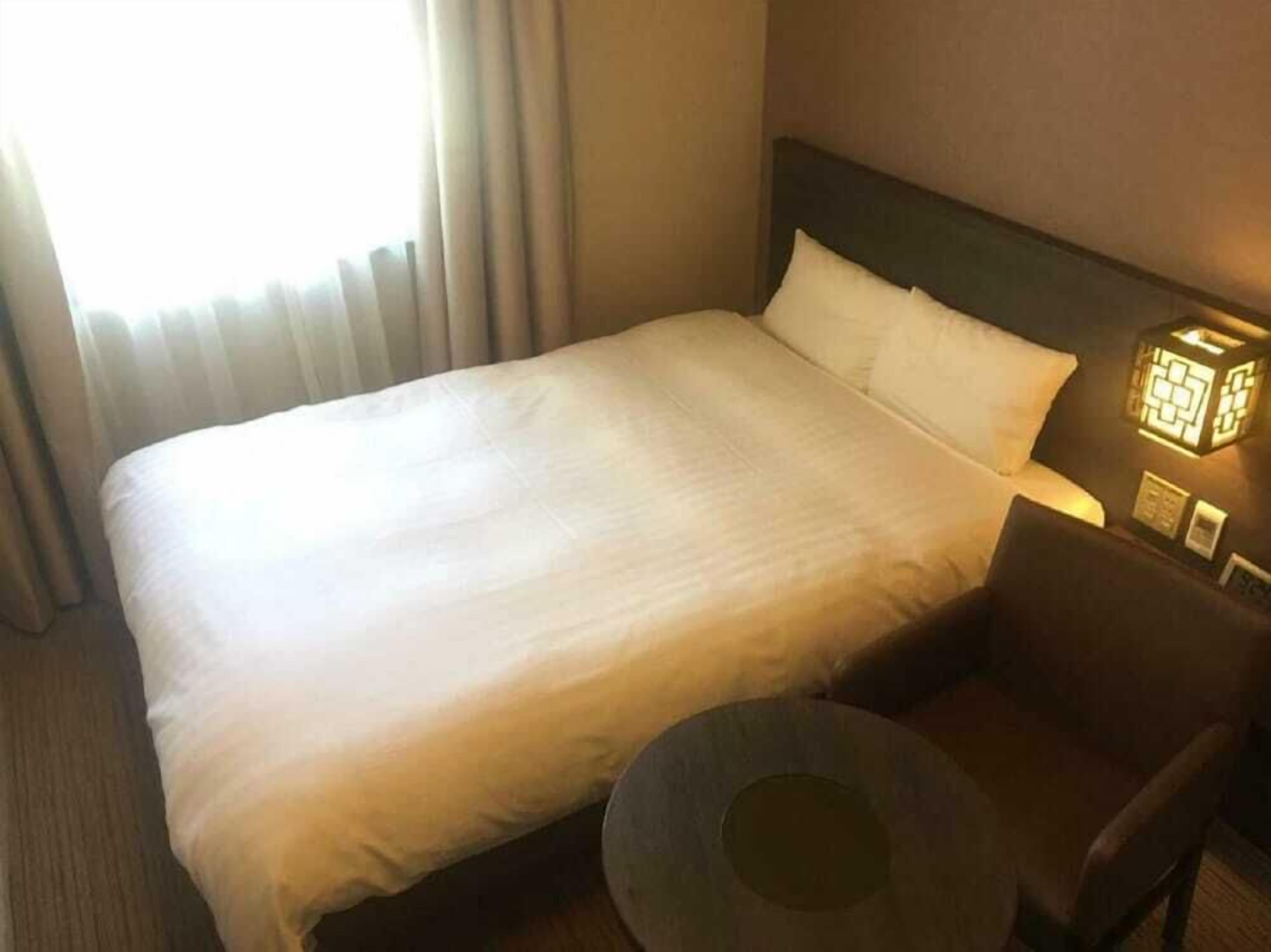 Premium bedding, down comforters, blackout drapes, iron/ironing board