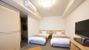 A hotel room with two beds, a TV, a desk, and a wardrobe. - Dormy Inn Tsu Natural Hot Spring (Tsu)