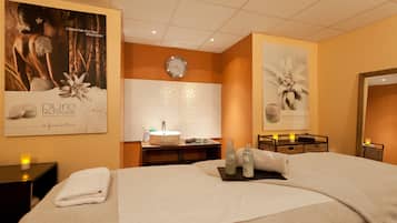 Relax in a serene space with a large bed, bedside table, and nightstand, perfect for unwinding.