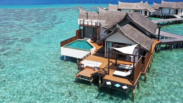 Overwater bungalows with a swimming pool, wooden deck, and thatched roofs. - Ozen Reserve Bolifushi- All Inclusive with Free Transfers (Bolifushi Island)
