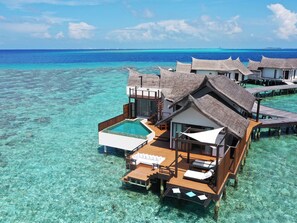 Overwater bungalows with a swimming pool, wooden deck, and thatched roofs. - Ozen Reserve Bolifushi- All Inclusive with Free Transfers (Bolifushi Island)