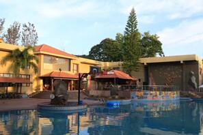 Outdoor pool, open 7 AM to 6:30 PM, pool umbrellas, sun loungers