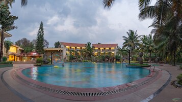 Outdoor pool, open 7 AM to 6:30 PM, pool umbrellas, sun loungers