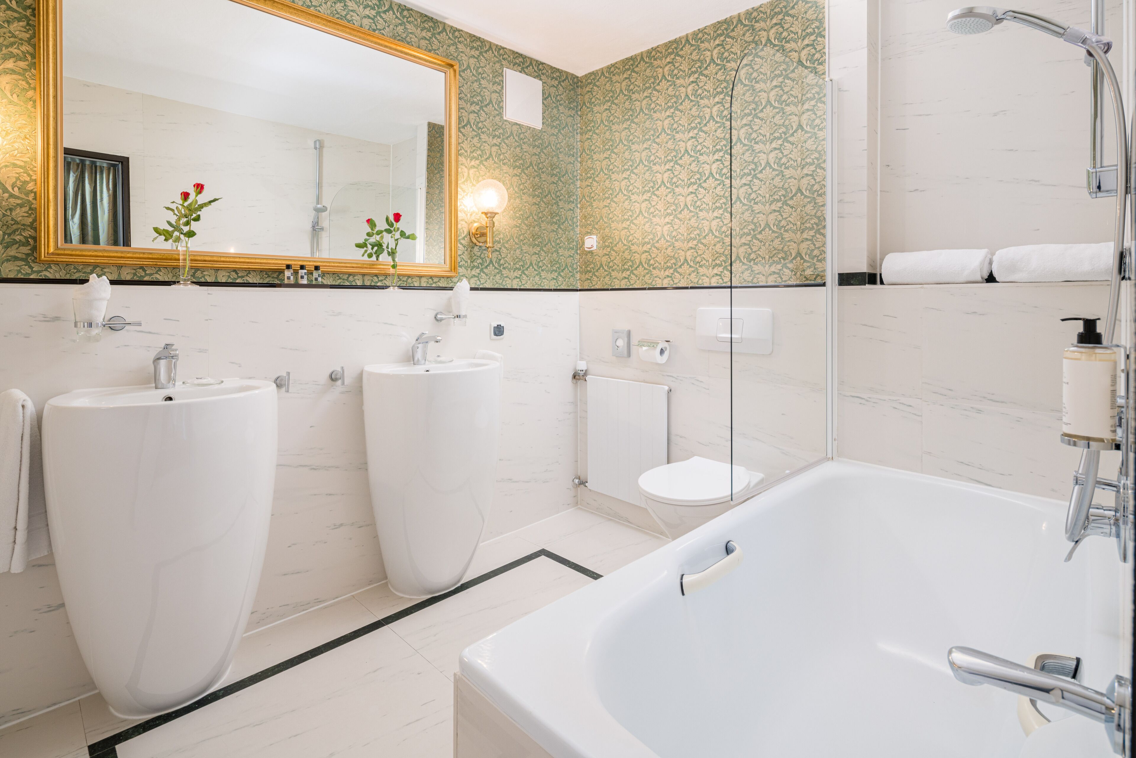 junior studio suite | bathroom | rainfall showerhead, free toiletries, hair dryer, bathrobes