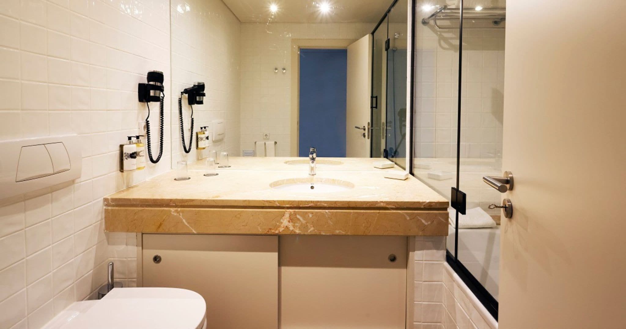 combined shower/bathtub, free toiletries, hair dryer, slippers