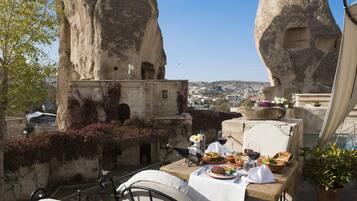 Enjoy a scenic meal on our outdoor dining terrace with a view of the historic cityscape.
