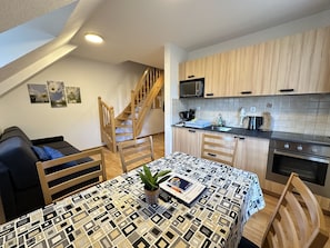 Standard Apartment, 2 Bedrooms, Kitchen | Living area | Flat-screen TV