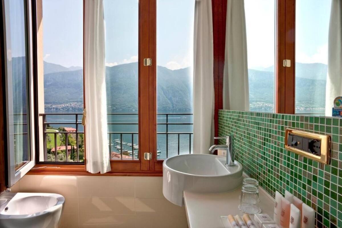 standard room, lake view (sunlit essential) | bathroom | hair dryer, bathrobes, slippers, bidet