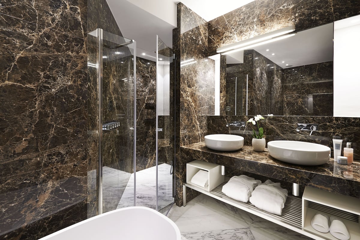 junior room, partial lake view | bathroom | hair dryer, bathrobes, slippers, bidet