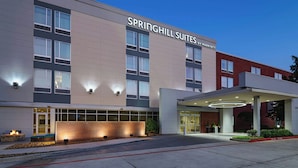 A modern hotel with a prominent sign reading "SPRINGHILL SUITES BY MARRIOTT".