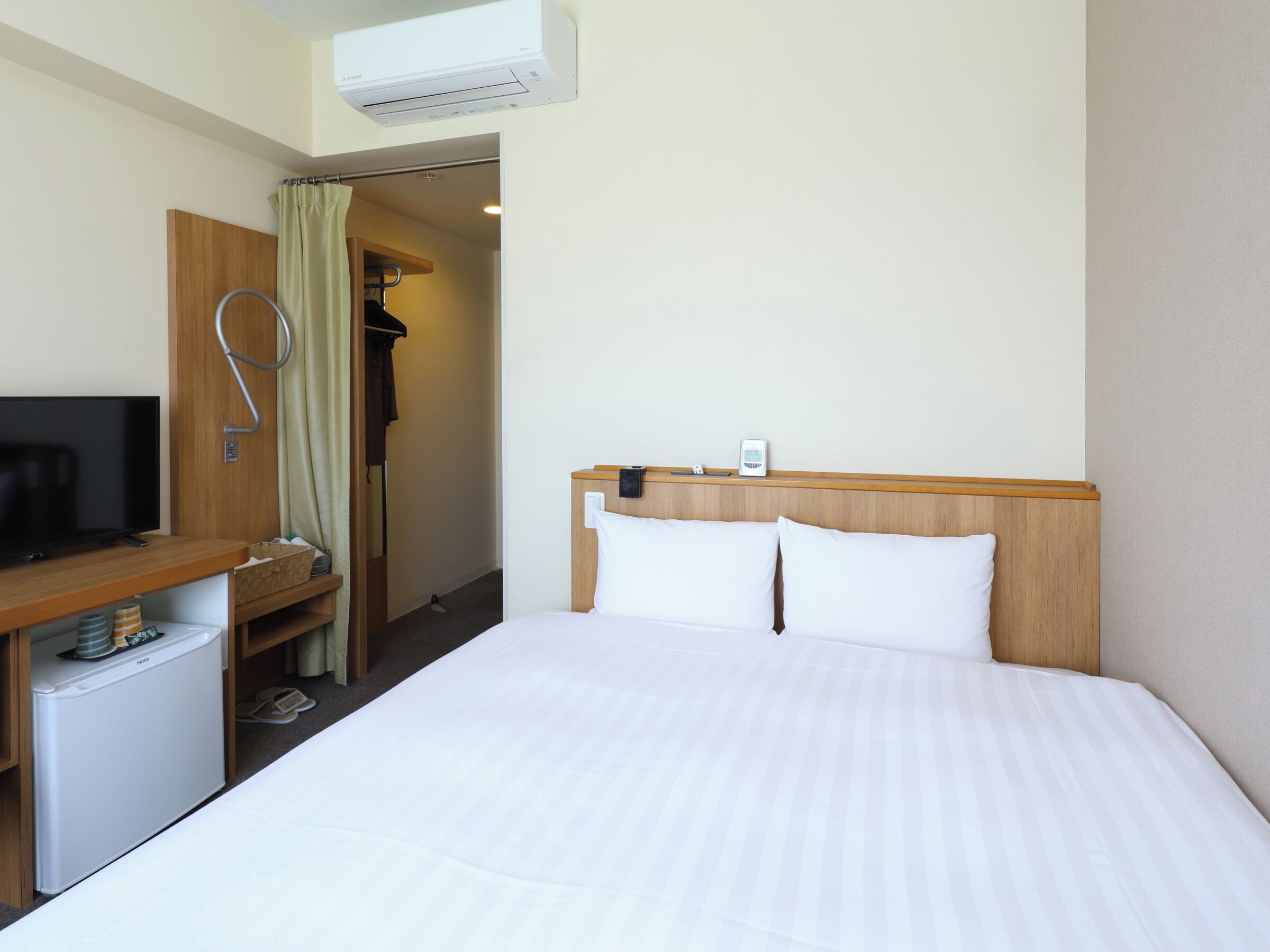 Down comforters, desk, blackout drapes, iron/ironing board