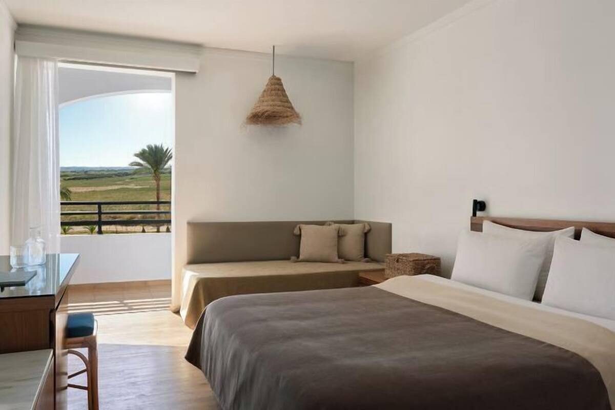 Down duvets, Select Comfort beds, in-room safe, desk