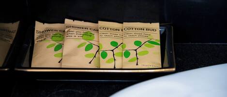 A tray with several paper bags labeled "Shower Bag" and "Cotton Bud."