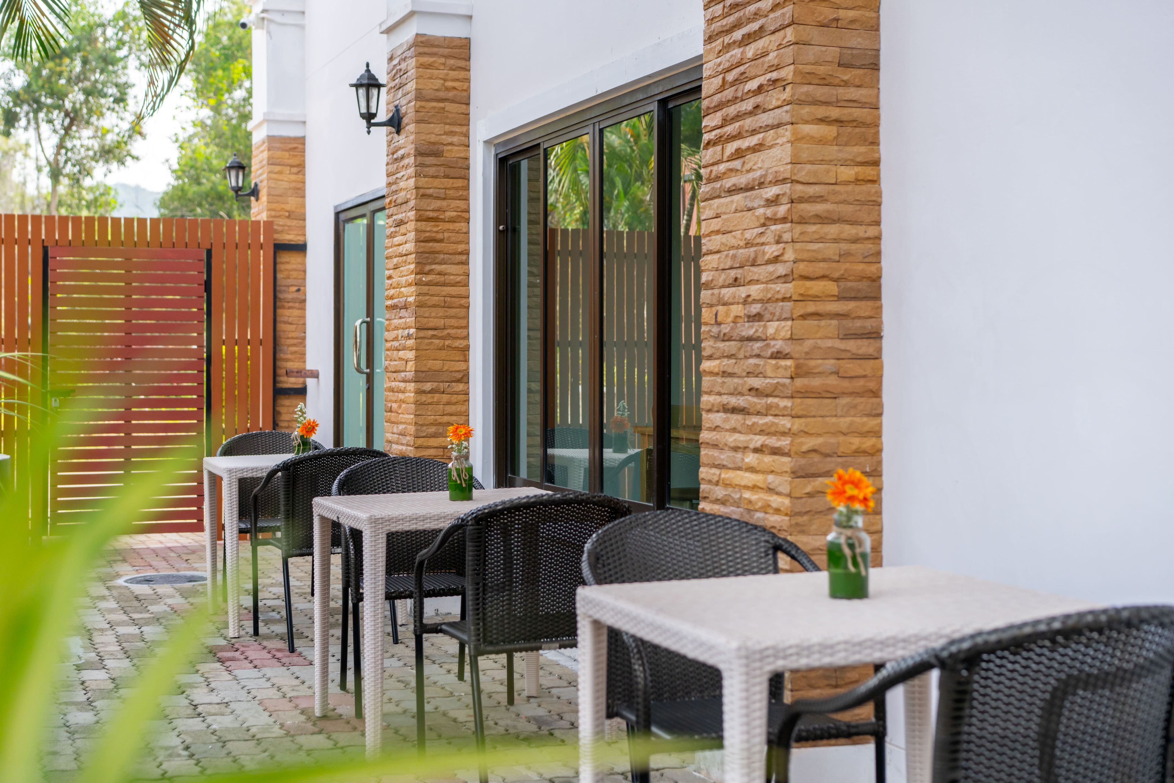 A patio area with outdoor seating and a view of the garden.