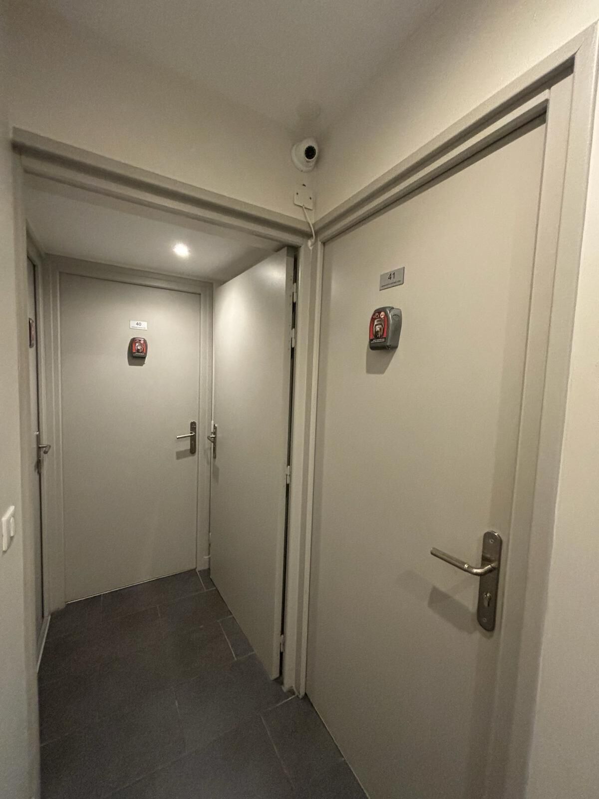 A hallway with doors numbered 40 and 41, equipped with fire alarms.