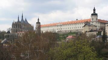 A large historic building with multiple towers and a prominent cathedral-like structure.